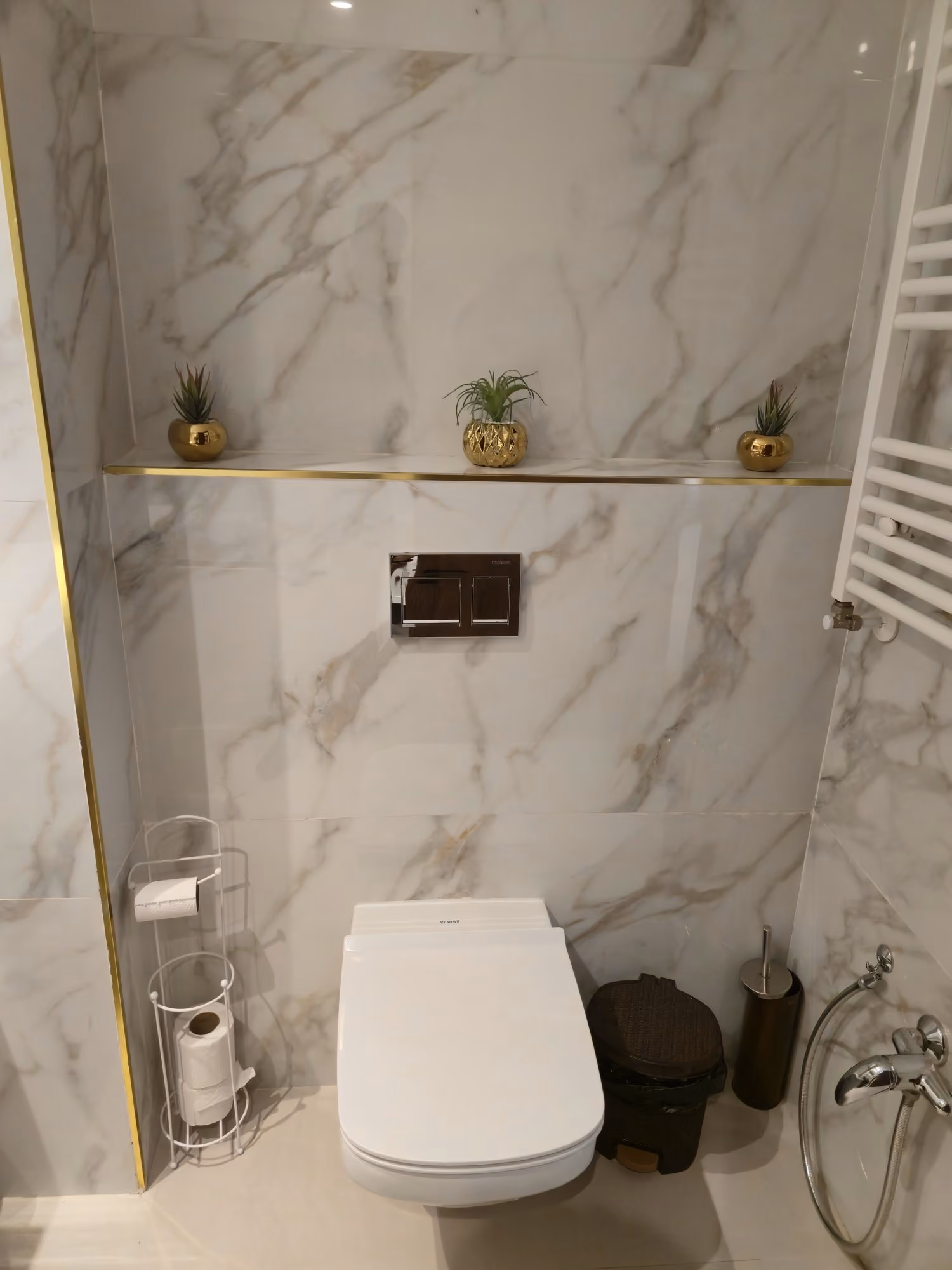 Marble bathroom with gold accents
